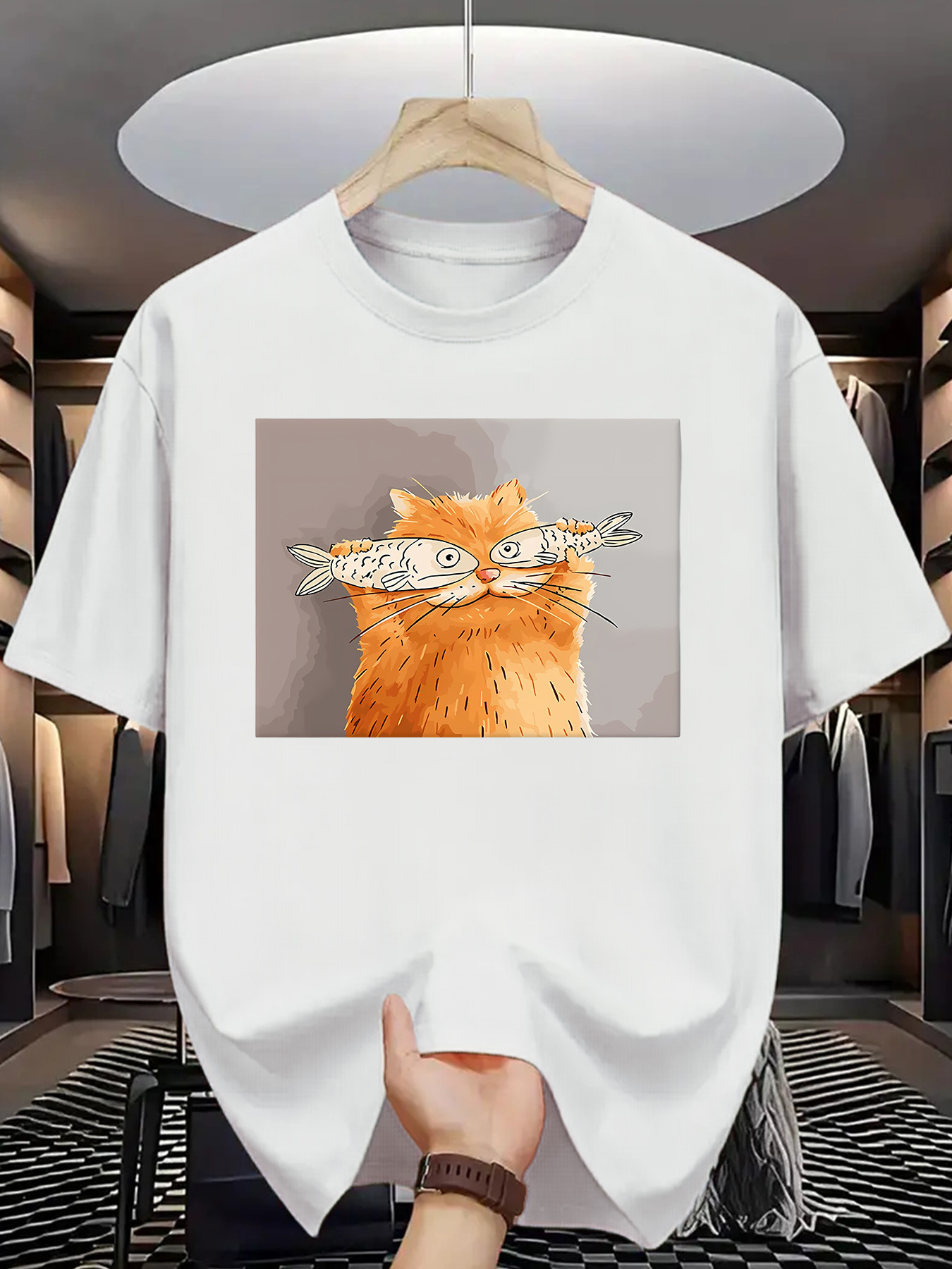 Men's Graphic T-Shirt Playful Orange Cat With Whimsical Fishes Balanced On Nose Cat