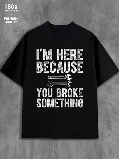 Men's Graphic T-Shirt Im Here Because Textured Lettering Above Cartoon Wrench And Large Slogan