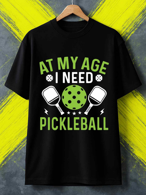 Men's Graphic T-Shirt At My Age I Need Pickleball Green Ball And Two Rackets Surrounded By Lightning