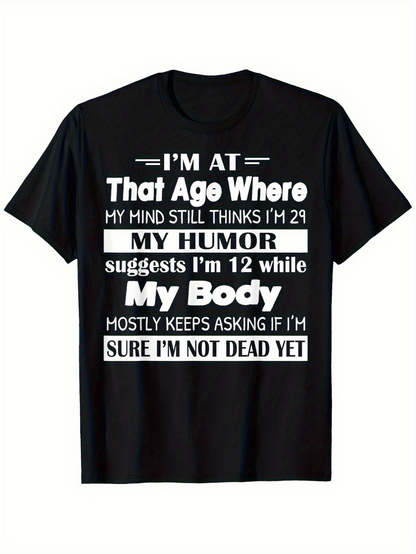 Men's Graphic T-Shirt Im At That Age Where My Humor Suggests Im Twelve While My Body Mostly Keeps Asking If Im Sure Im Not Dead Yet