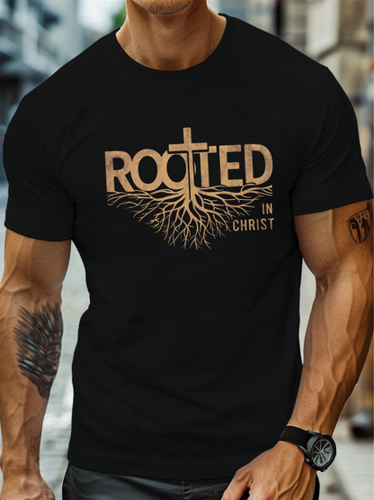 Men's Graphic T-Shirt Rooted In Christ Tree Roots Extending Beneath Golden Lettering Cross