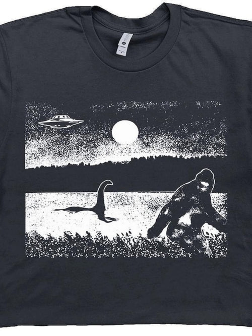 Men's Graphic T-Shirt Moonlit Mystery Landscape With UFO Bigfoot And Lake Monster