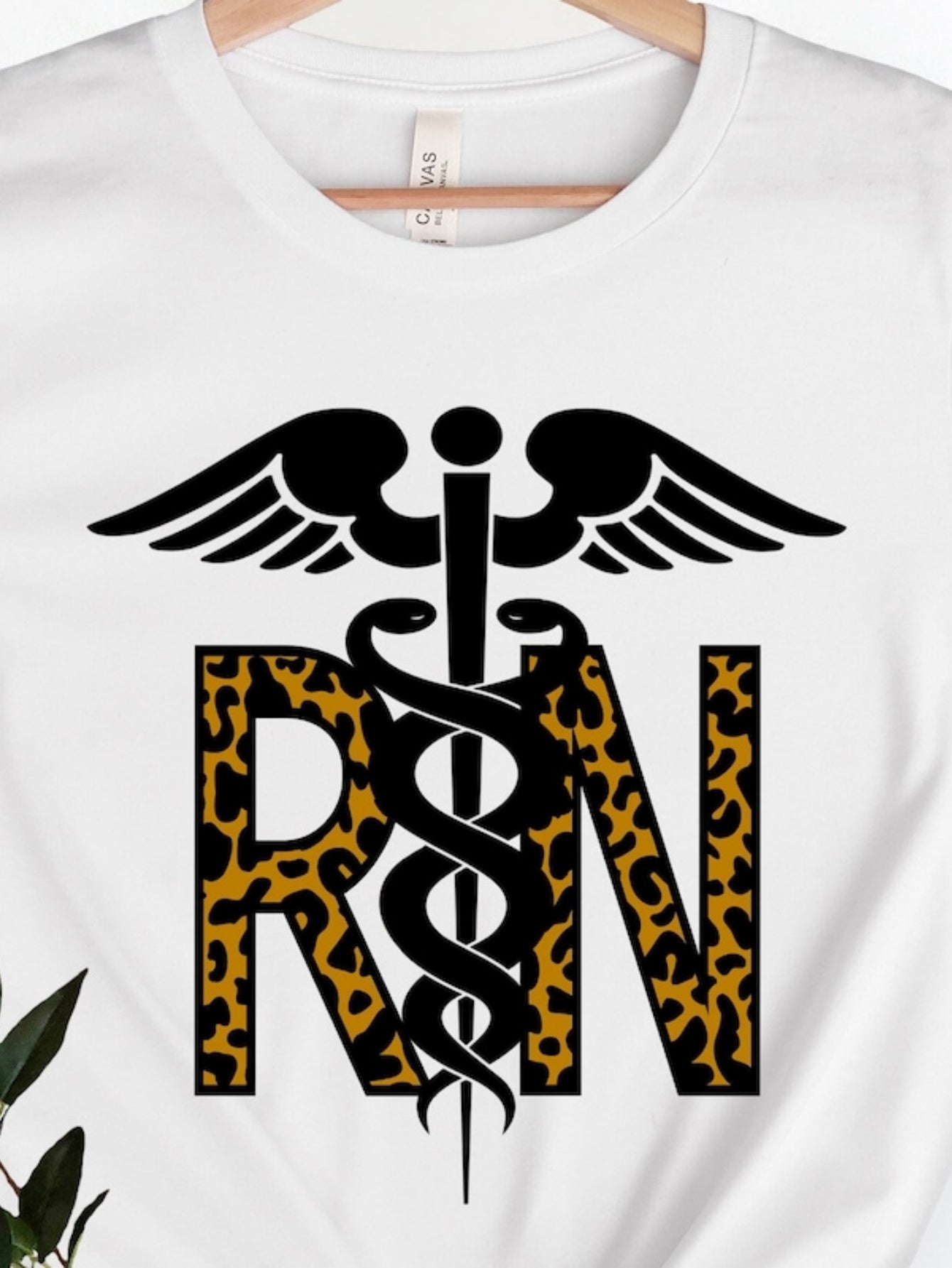 Men's Graphic T-Shirt Leopard Pattern Surrounding Caduceus Symbol And Bold RN Letters