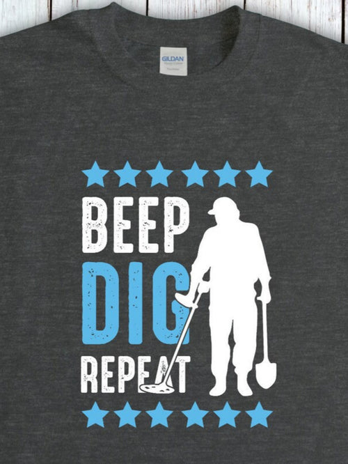Men's Graphic T-Shirt Beep Dig Repeat Scattered Blue Stars Surrounding A Metal Detector Man