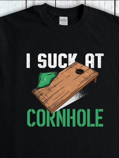 Men's Graphic T-Shirt I Suck At Cornhole Distressed Wooden Board With Green Bean Bag Game Cornhole