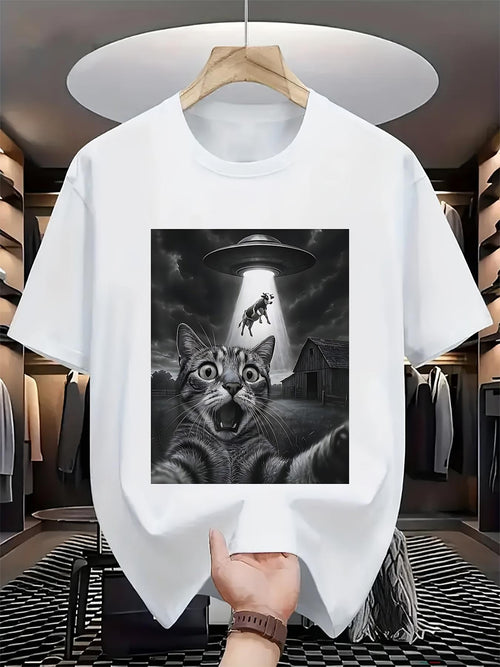 Men's Graphic T-Shirt Dramatic Nighttime Scene With UFO Beaming Cows Above Surprised Cat