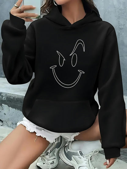 Women's Graphic Hoodie Line Drawn Mischievous Smile Face On Cozy Black Hoodie