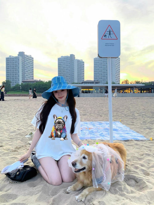 Women's Graphic T-Shirt Adorable Frenchie Wearing Colorful Hoodie Sitting On Sunny Beach Bulldog